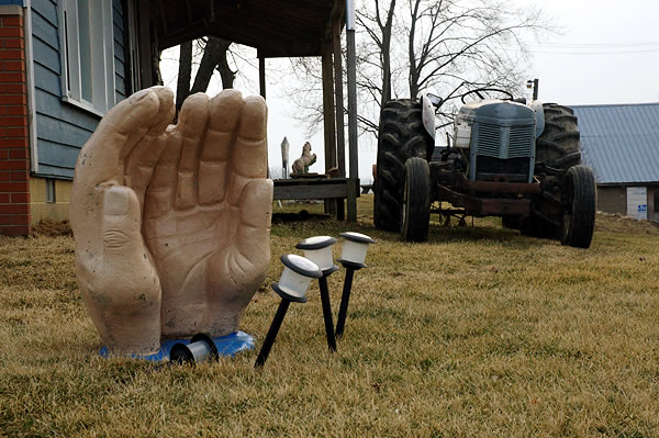 Cupped hands and tractor, Quince Rd.