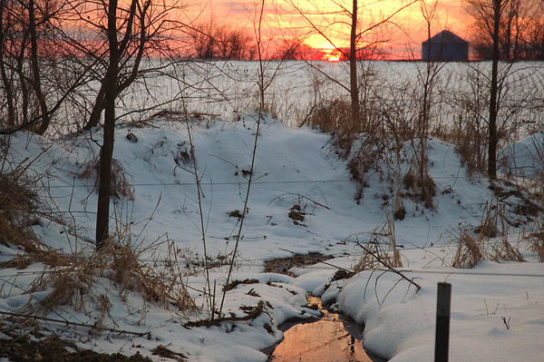 Snow and sunset reflection