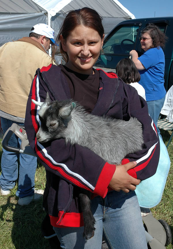 Young woman with her goat, Animal Swap Meet, Ligonier