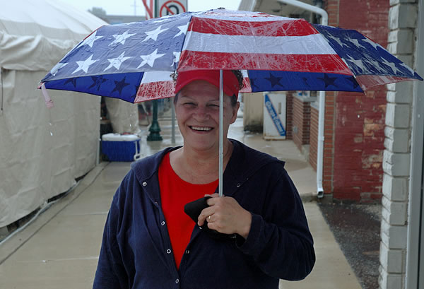 Woman with a patriotic umbrella, N Judson Mint Festival