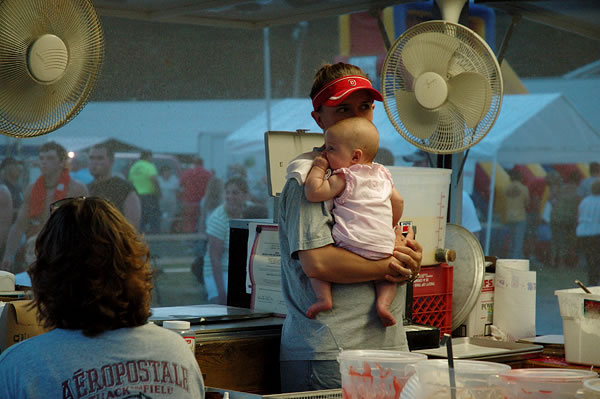 Woman and baby, food booth, Starke County Fair, Hamlet