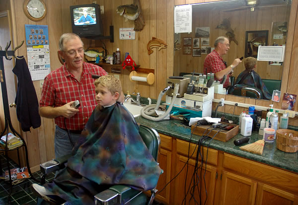 Getting a haircut at Chuck's Barbershop