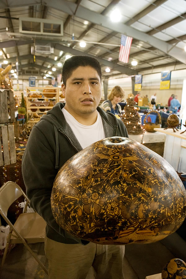 Percy Medina, artist and director of the Museo do Mates Burilados Evaristo Medina Zanabria in Cochas Chico, Peru, at the Indiana Gourd Society show